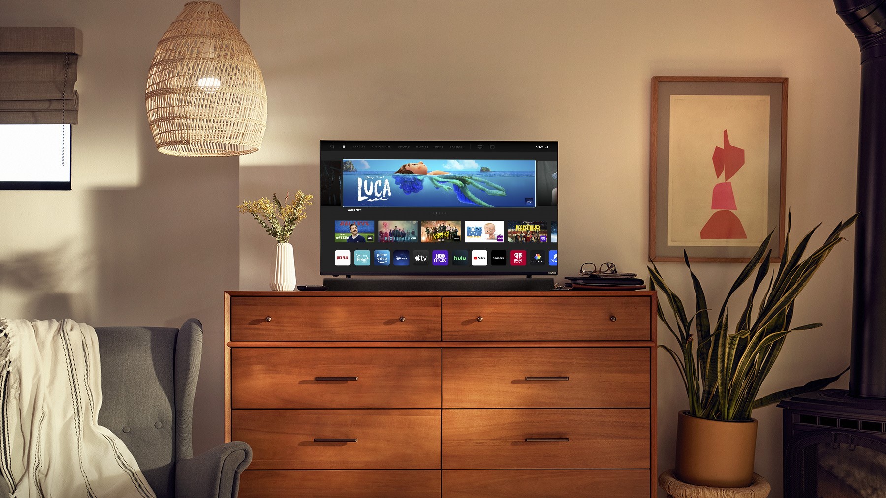 The Vizio D-Series on a set of drawers in a bedroom.