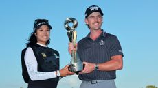 Patty Tavatanakit and Jake Knapp hold the Grant Thornton Invitational trophy