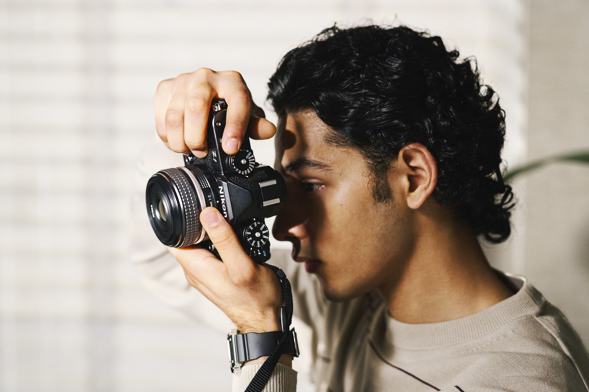 Photographer with Nikon Z f at golden hour