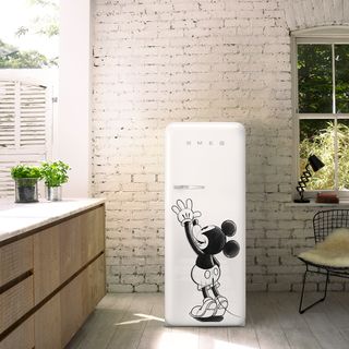 kitchen with brick wall and mickey mouse fridge