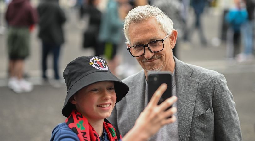 Gary Lineker, who is presenting for the BBC at Euro 2024, poses for a selfie with a young fan ahead of the Europa League final in Dublin in May 2024.