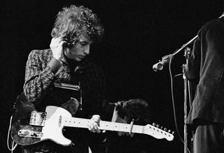 Bob Dylan performs in Paris, June 25, 1966.