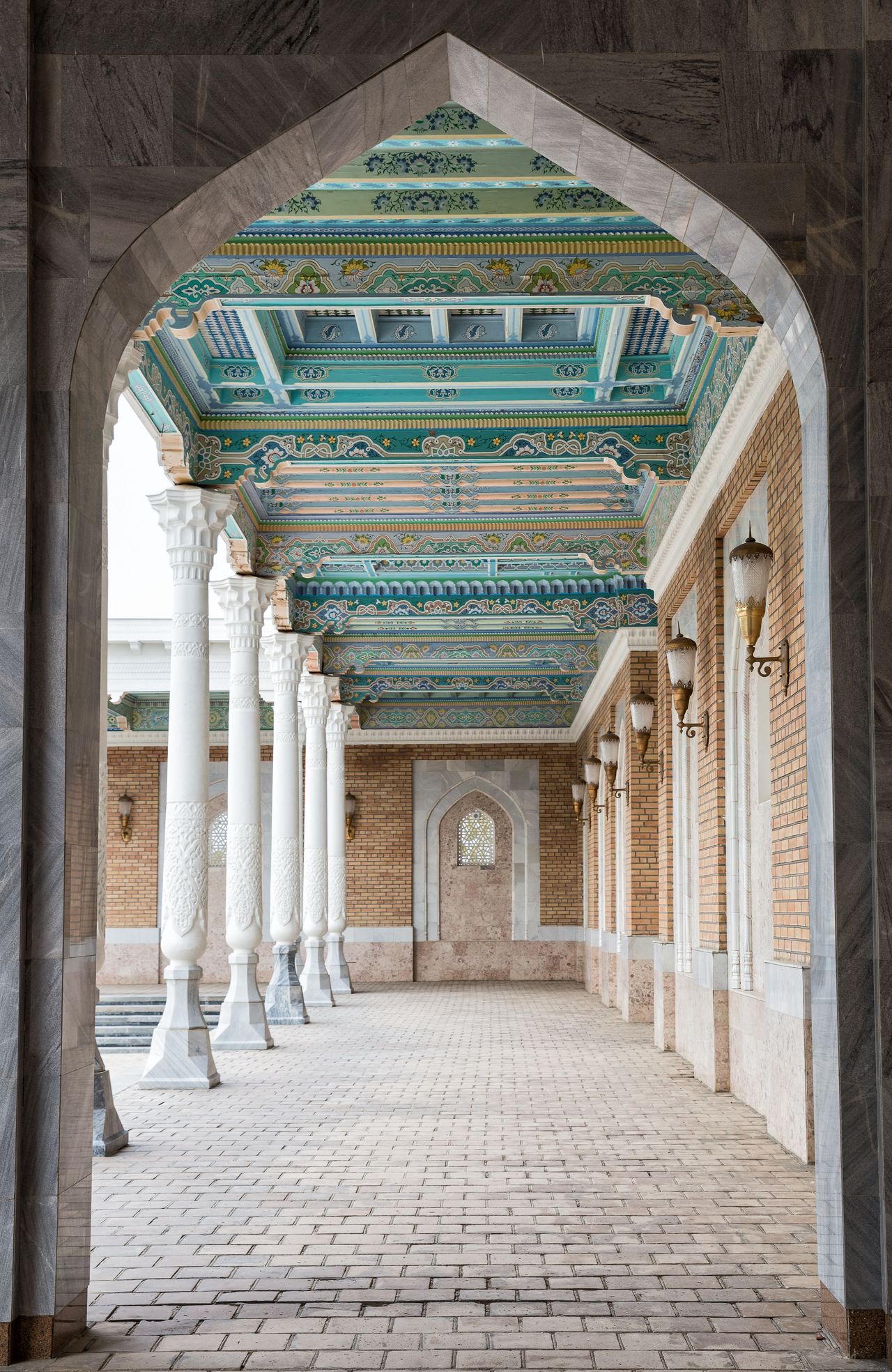 A colorful historical building features blue decor in Uzbekistan.