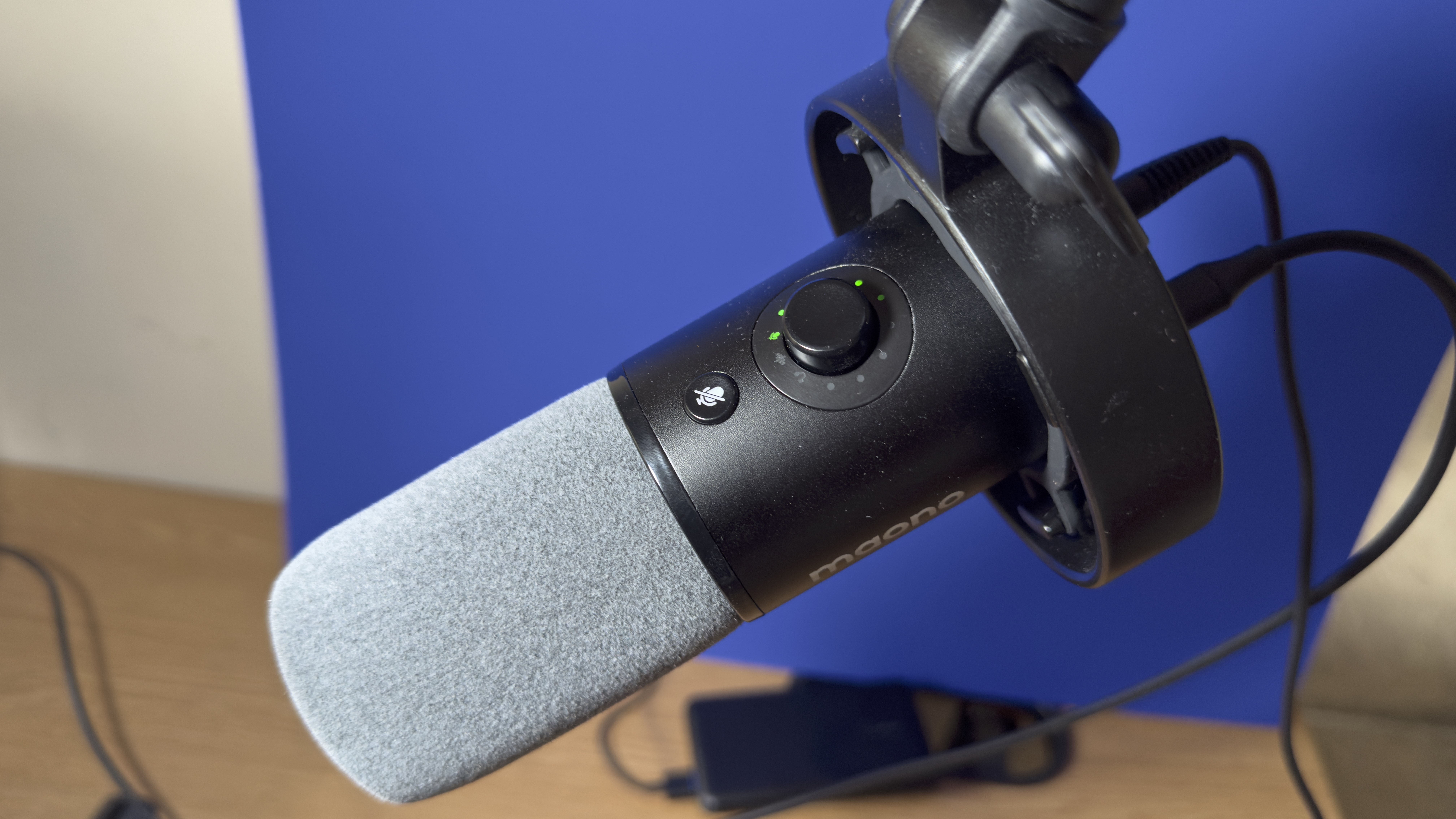 Close-up of the grey foam pop shield that protect the mic from ‘popping’ when you produce plosive sounds