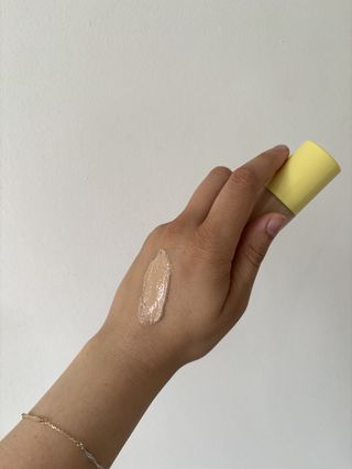 a swatch of the Kosas BB Burst Tinted Gel Cream on the back of Mica Rickett's hand