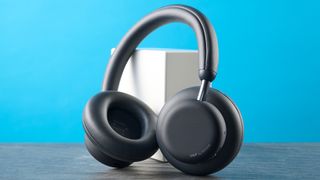 the cmf headphone pro / cmf by nothing headphone pro / nothing headphone pro in black photographed against a blue tom's guide background