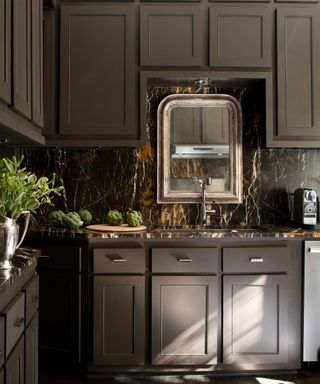 Brown color drenched kitchen with brown cabinets and a brown marble backsplash