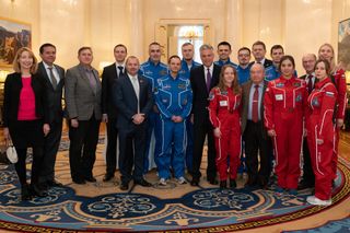 The SIRIUS-18/19 crew poses with representatives from the United States, Russia, NASA and Institute of Biomedical Problems at the American Embassy in Moscow.
