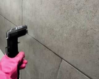 Using Bissell SpotClean HydroSteam to clean bathroom wall tile