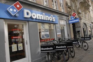 American chain Dominos pizza delivery by Domino's bicycles