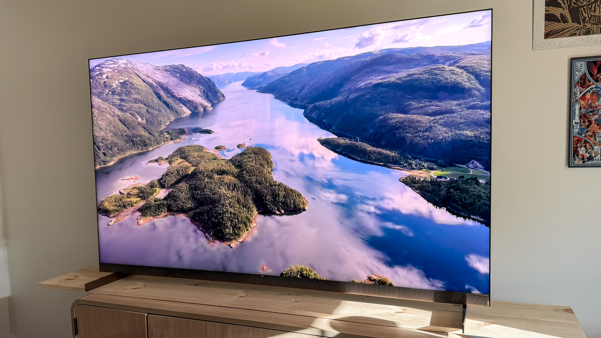 TCL X11L SQD Mini-LED TV on a side table