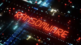 Circuit board with word ransomware lit up in neon red