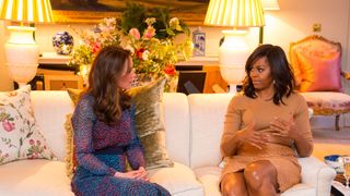 Catherine, Princess of Wales speaks with Michelle Obama in the Drawing Room of Apartment 1A Kensington Palace