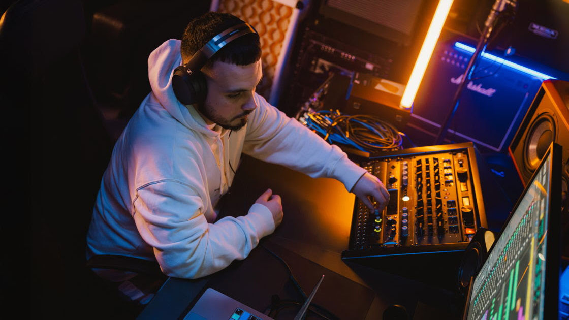 The new the closed-back HD 480 PRO headphones on a male mixer in a studio. 