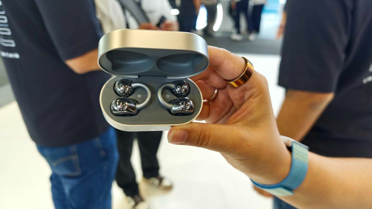 Noise Master Buds Open with Sound by Bose, held in a hand