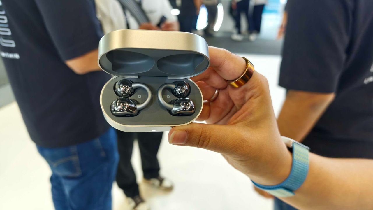 Noise Master Buds Open with Sound by Bose, held in a hand