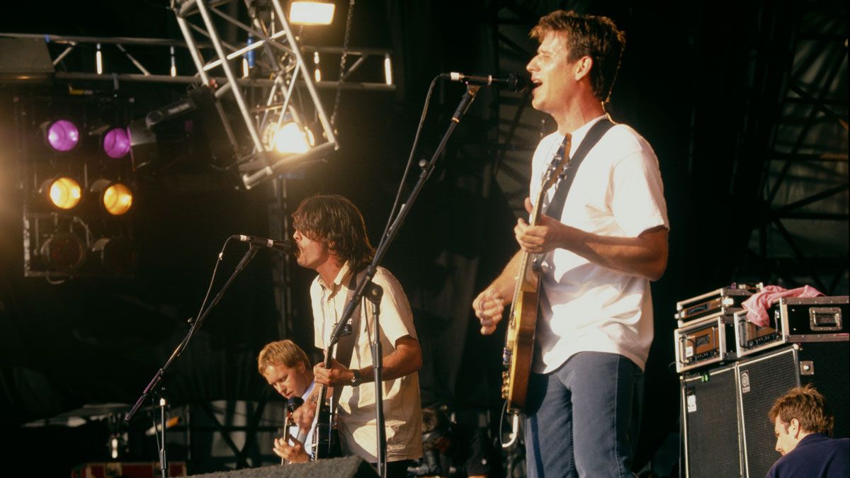 American alternative rock group Foo Fighters, performing on stage, 1998. Left to right: Nate Mendel, Dave Grohl and Franz Stahl.