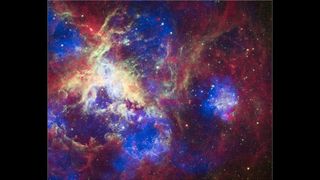 the Tarantula nebula in colorized X-rays, showing blue, yellow, red and purple light