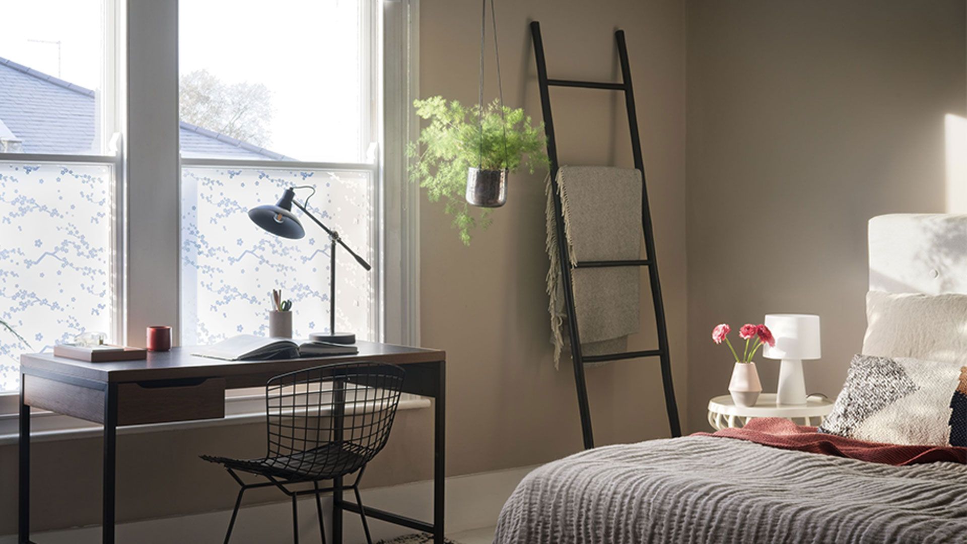 Serene Japandi style bedroom with low bed and towel ladder