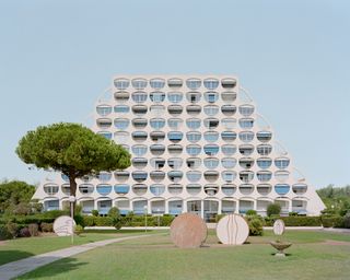 La Cité Oasis, a photographic series on La Grande Motte, shot by Charly Broyez & Laurent Kronental and showing sculptural, white and geometric modernist architecture in the south of france, surrounded by green spaces and in monumental scale