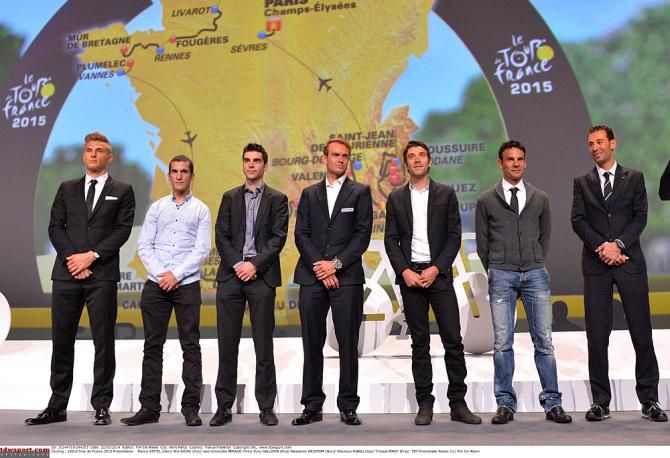 Riders pose in front of the 2015 Tour de France route in Paris
