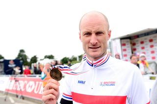 Steve Cummings with his medal and his new national champs jersey