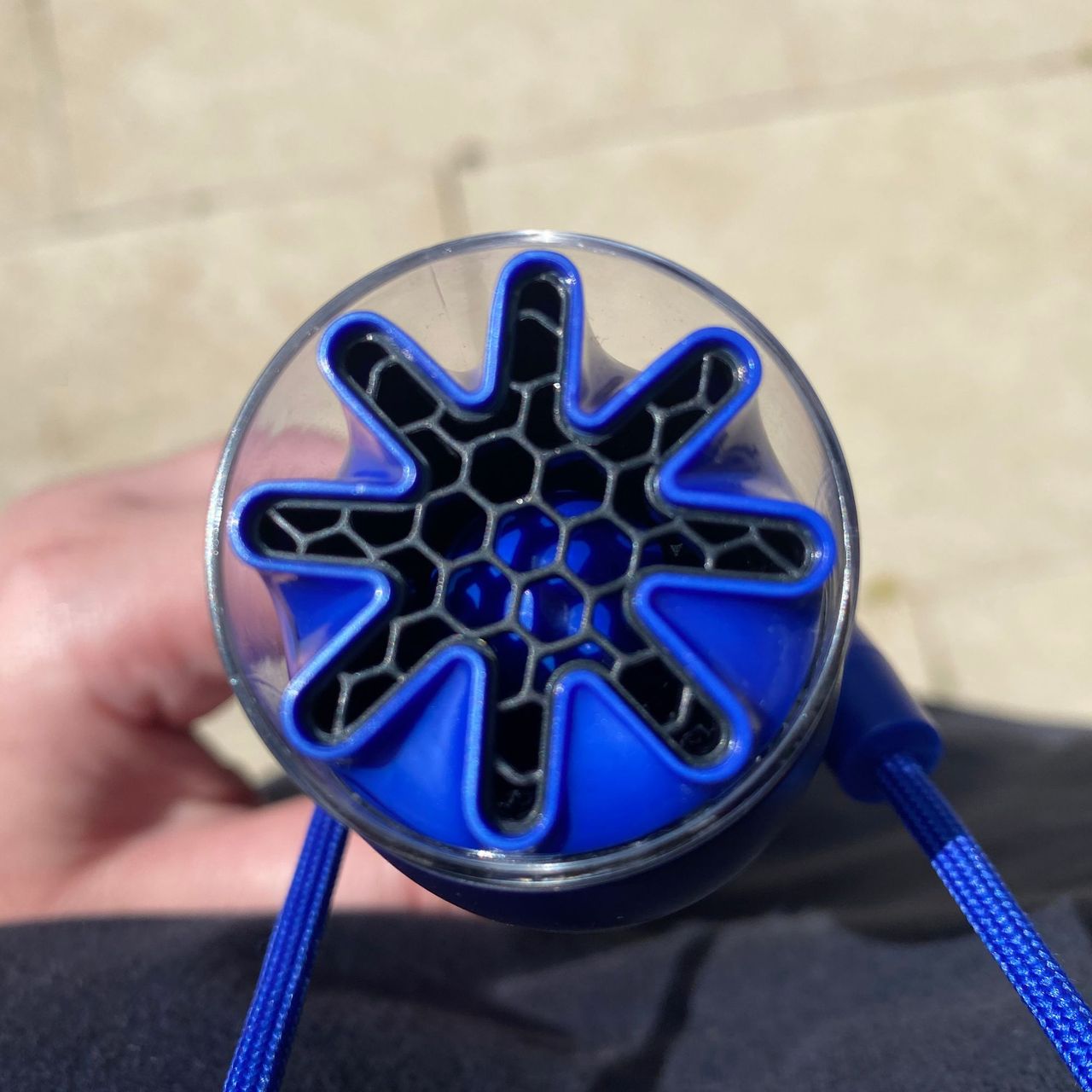 Fan head of the Dyson HushJet Mini Cool fan, twisted to face up while attached to the neck dock