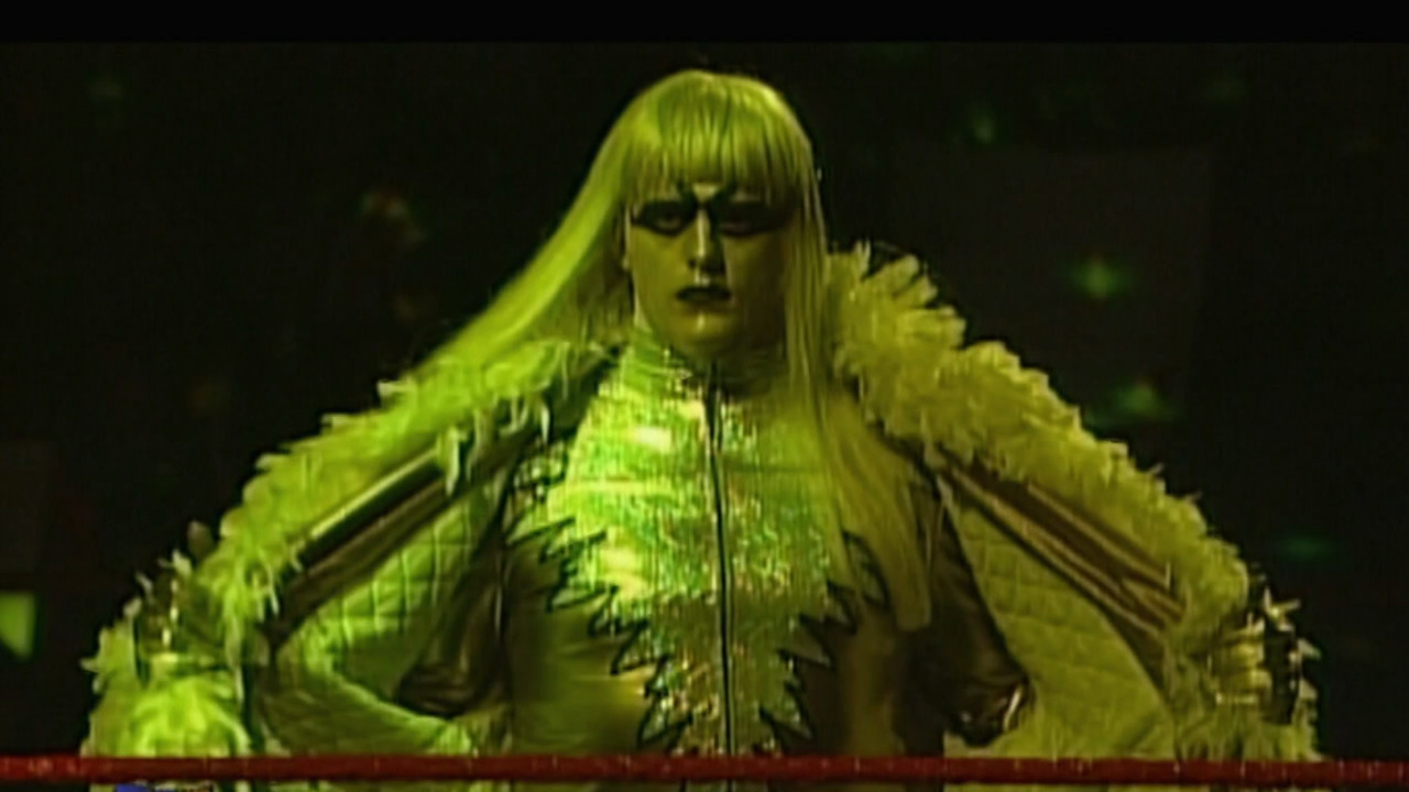 Goldust taking off his robe.