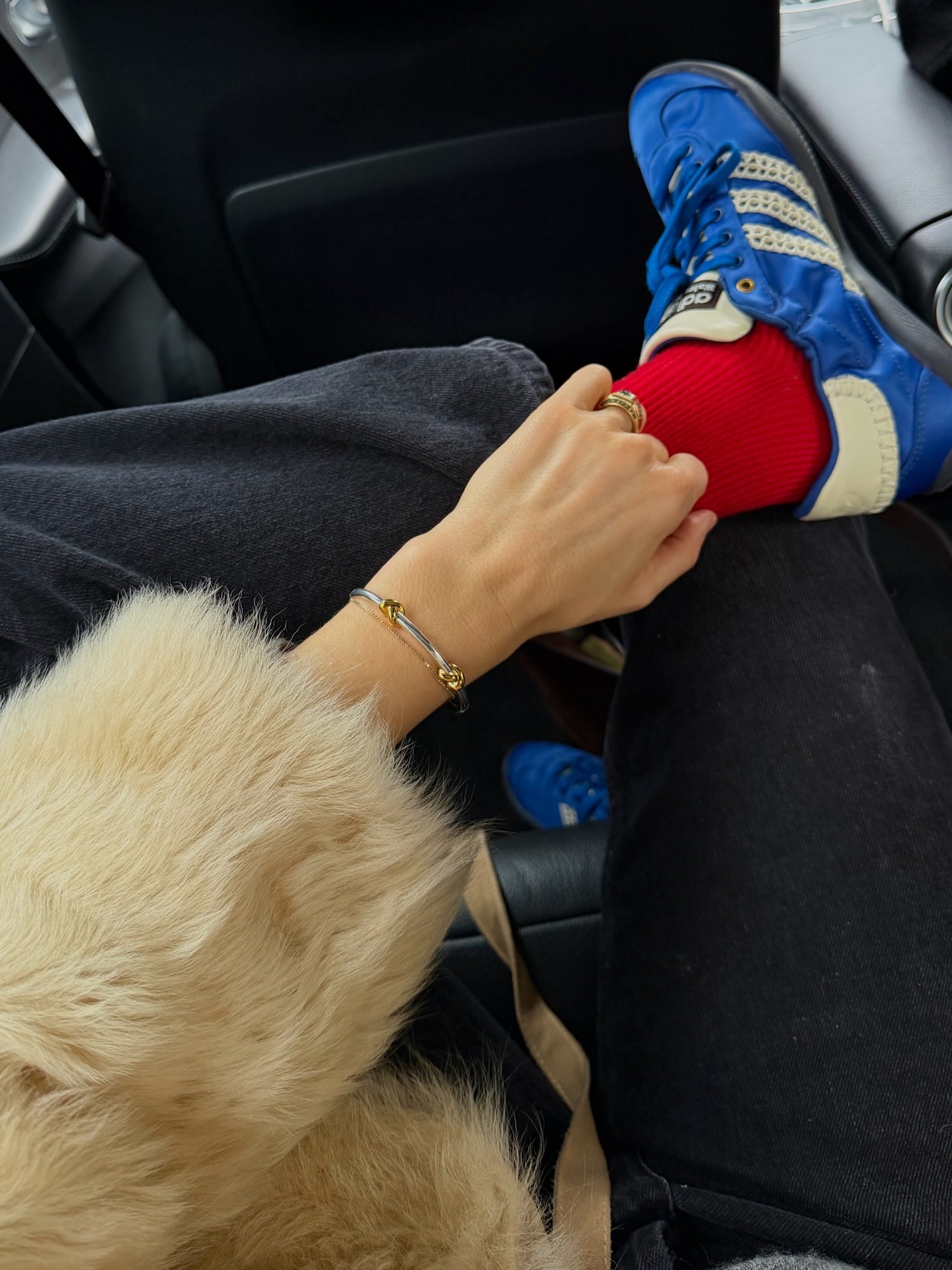 Woman in blue sneakers and red socks