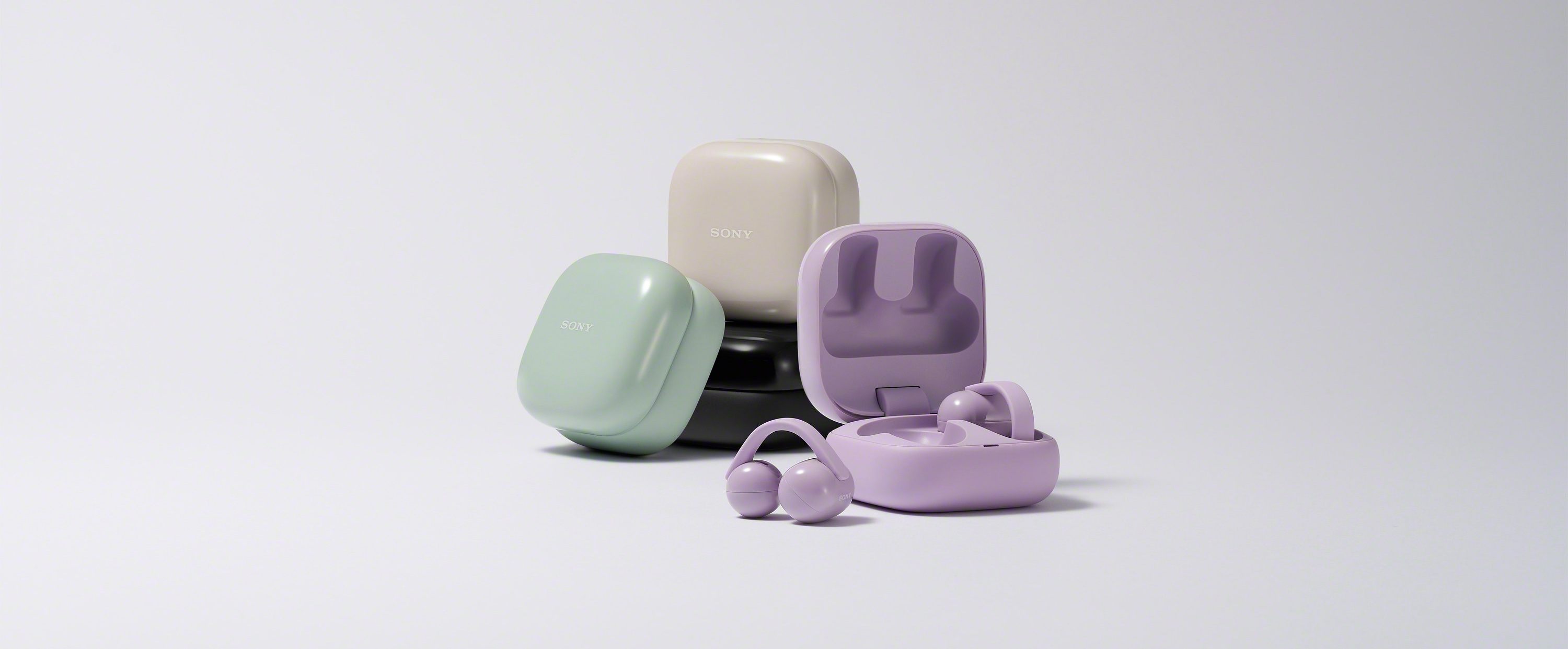 As stack of Sony LinkBuds Clip cases and earbuds in different colours