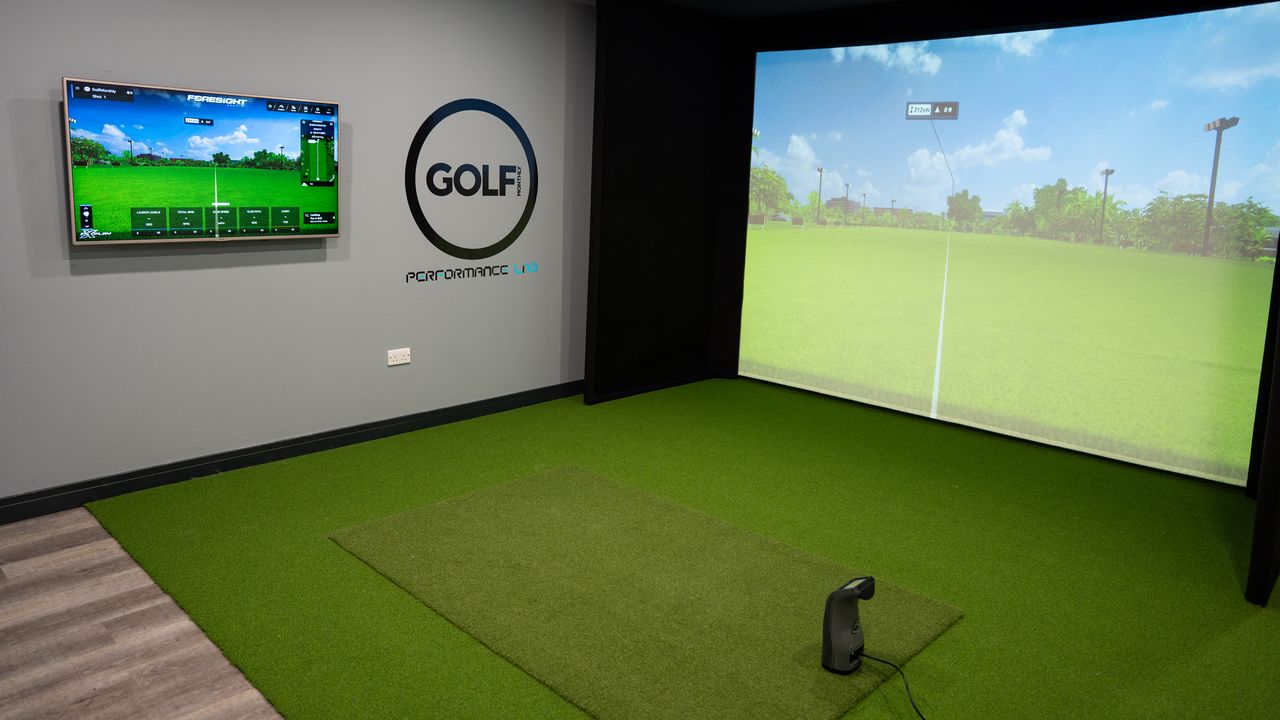an image of an indoor golf simulator studio