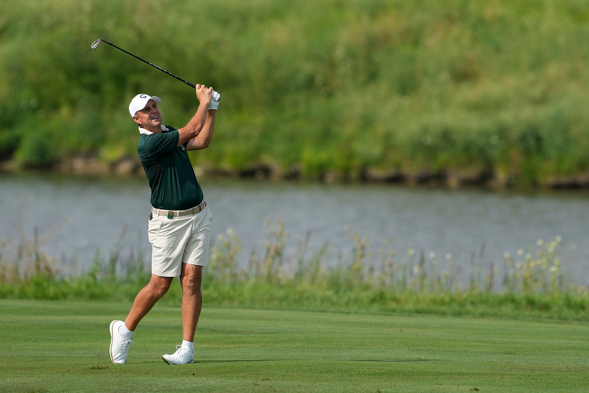 Richard Bland in the finish position with an iron after hitting a shot from the fairway