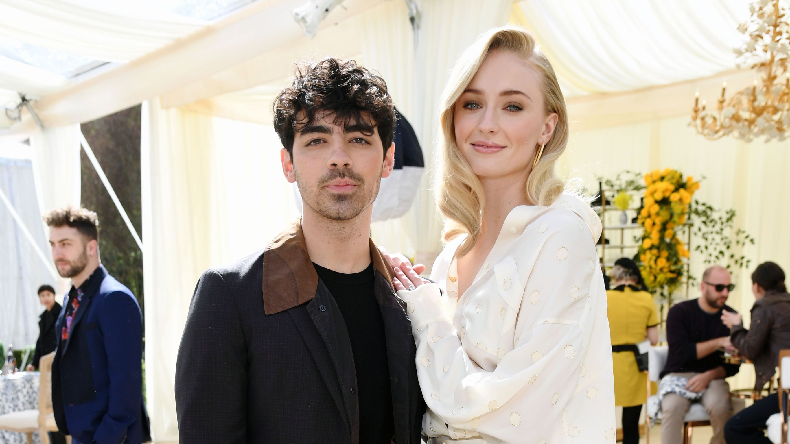 Sophie Turner at Emmys in pink Louis Vuitton as Joe Jonas calls