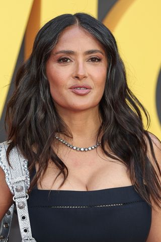 Salma Hayek is pictured with her dark hair in loose waves - with a few grey strands visible around her face - at the European premiere of "Blink Twice" at the Odeon Luxe Leicester Square on August 19, 2024 in London, England.