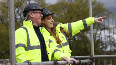 Keir Starmer and Angela Rayner wearing construction gear and smiling