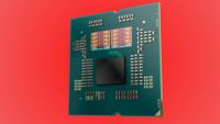 Image of a Ryzen 9000 series processor with the heat spreader removed, against a red background