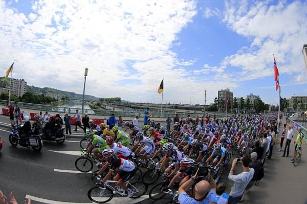 The Tour de France peloton rolls along in the neutral section at the beginning of stage 5.