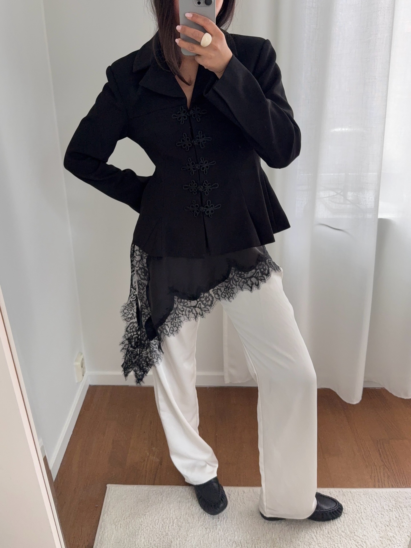 Woman in lace-trim dress over jeans