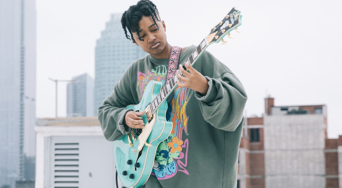 Melanie Faye plays her new signature D&#039;Angelico Deluxe DC guitar