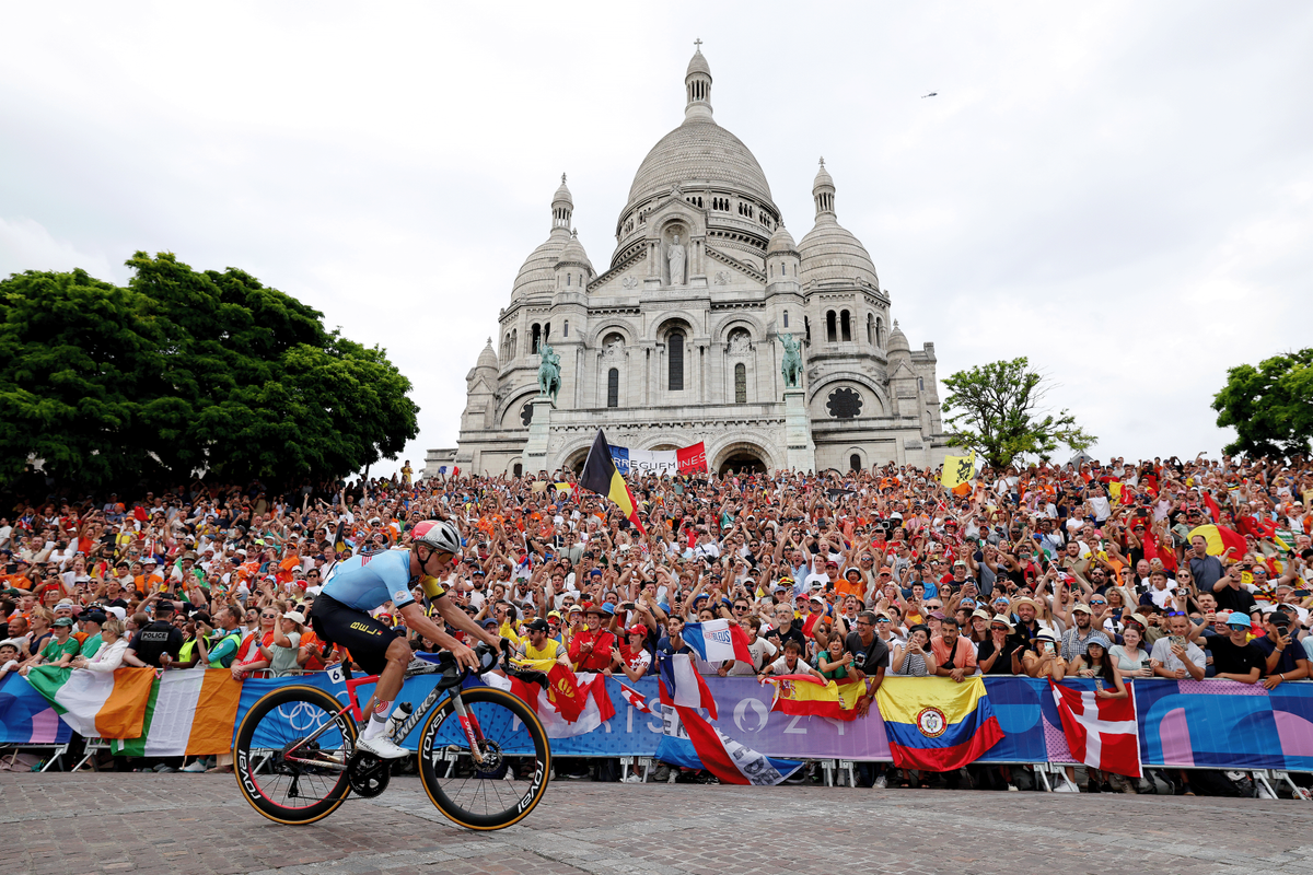 PARIS, FRANCE - AUGUST 03: Remco Evenepoel of Team Belgium attacks in the breakaway passing by the Basilica of the Sacre Coeur during the Men&#039;s Road Race on day eight of the Olympic Games Paris 2024 at trocadero on August 03, 2024 in Paris, France. (Photo by Alex Broadway/Getty Images)