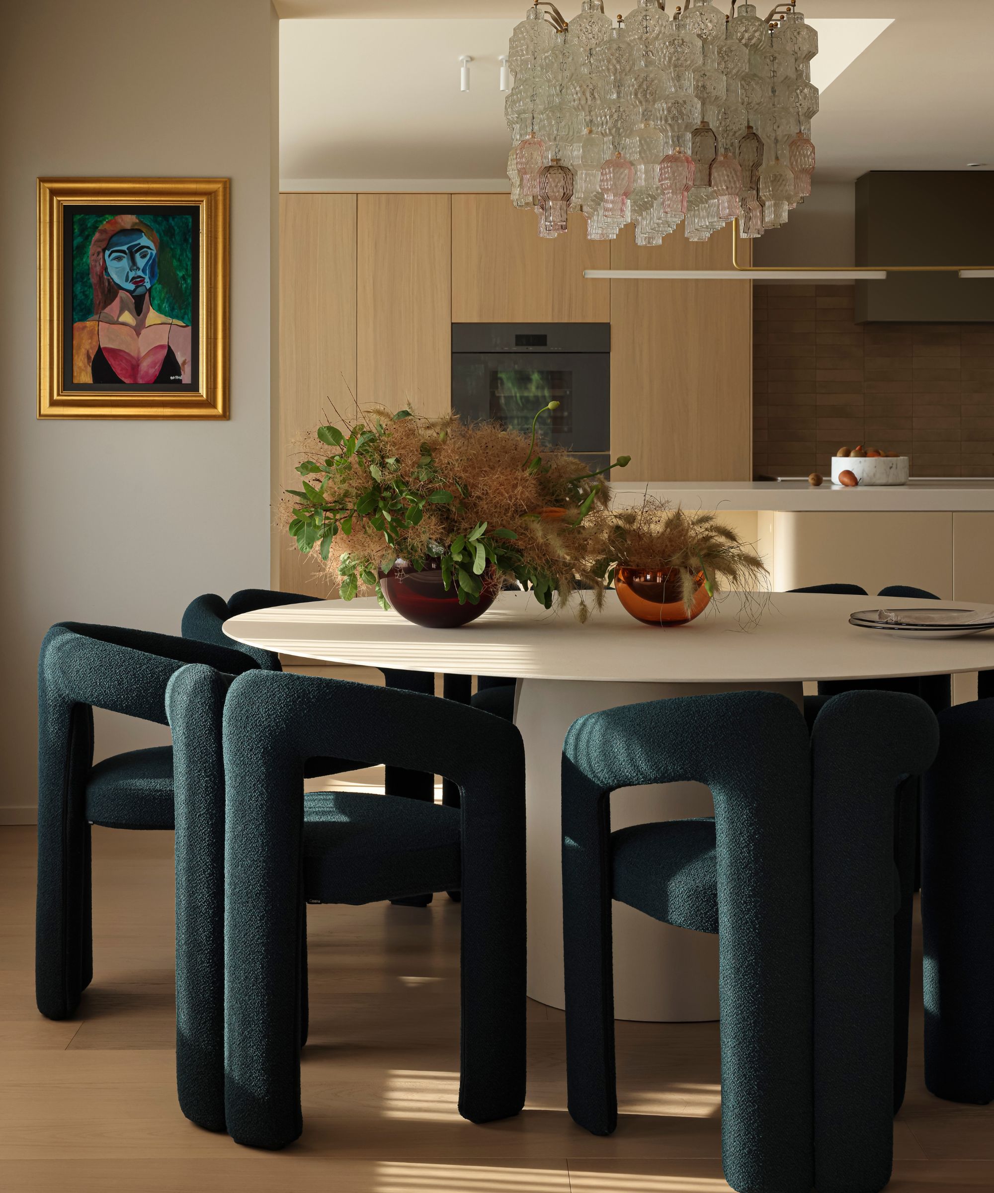 eat-in kitchen with round table and modern art