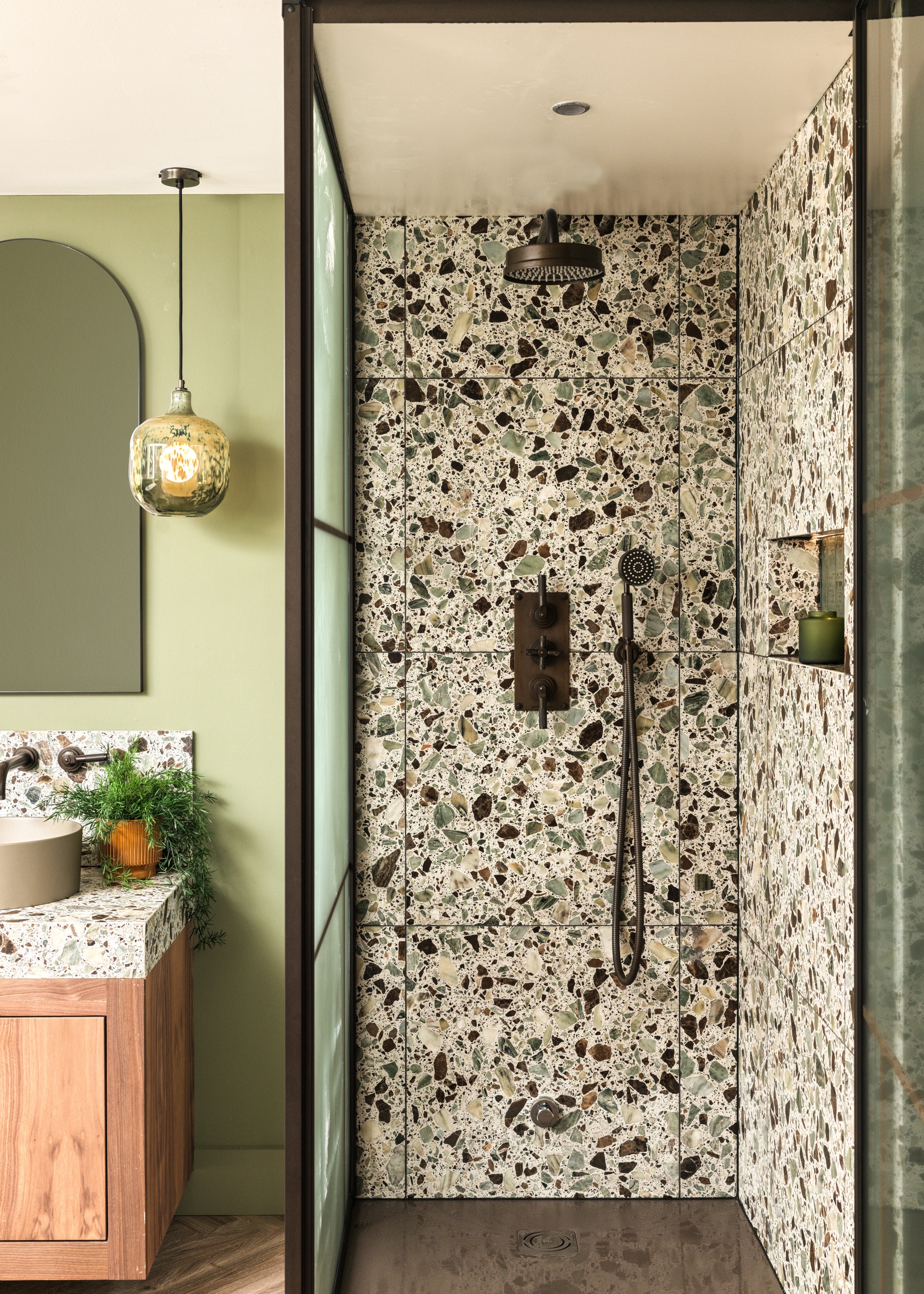 green bathroom with terrazzo tile shower by Ca Pietra