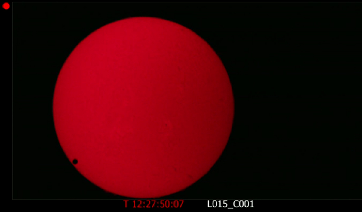 Venus fully enters the sun&#039;s disk in this view of the June 5, 2012 Venus transit from a telescope atop Mauna Kea, Hawaii, during a NASA webcast. Venus appears at lower left, a position created by the telescope itself. Venus was actually at upper left at t