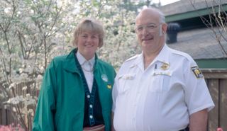 Davies poses with a security guard during the 1992 Masters