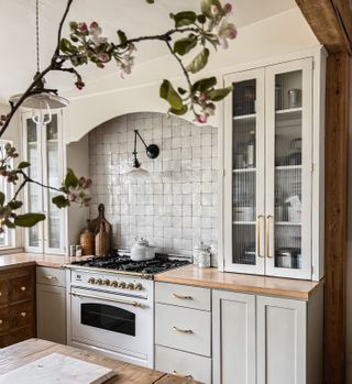 A kitchen with glistening zellige tiles used on the backsplash