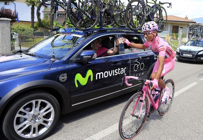 Clink! Quintana celebrates with team manager Eusebio Unzue