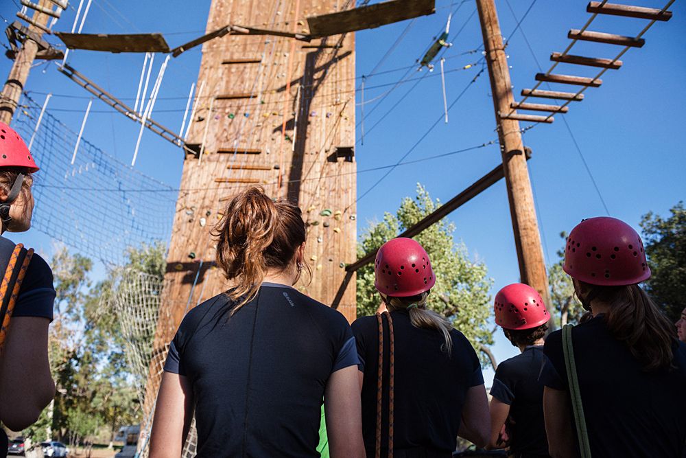 Cylance Pro Cycling Women's WorldTour riders look up at the high ropes test in Irvine, California