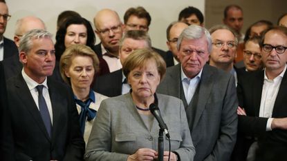 Merkel stands with her CDU allies, who may yet decide her fate