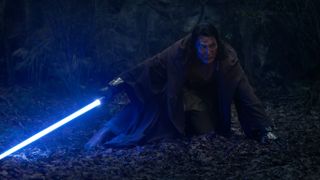 Jedi Master Sol (Lee Jung-jae) wielding his blue lightsaber at night in the Disney Plus original series, 