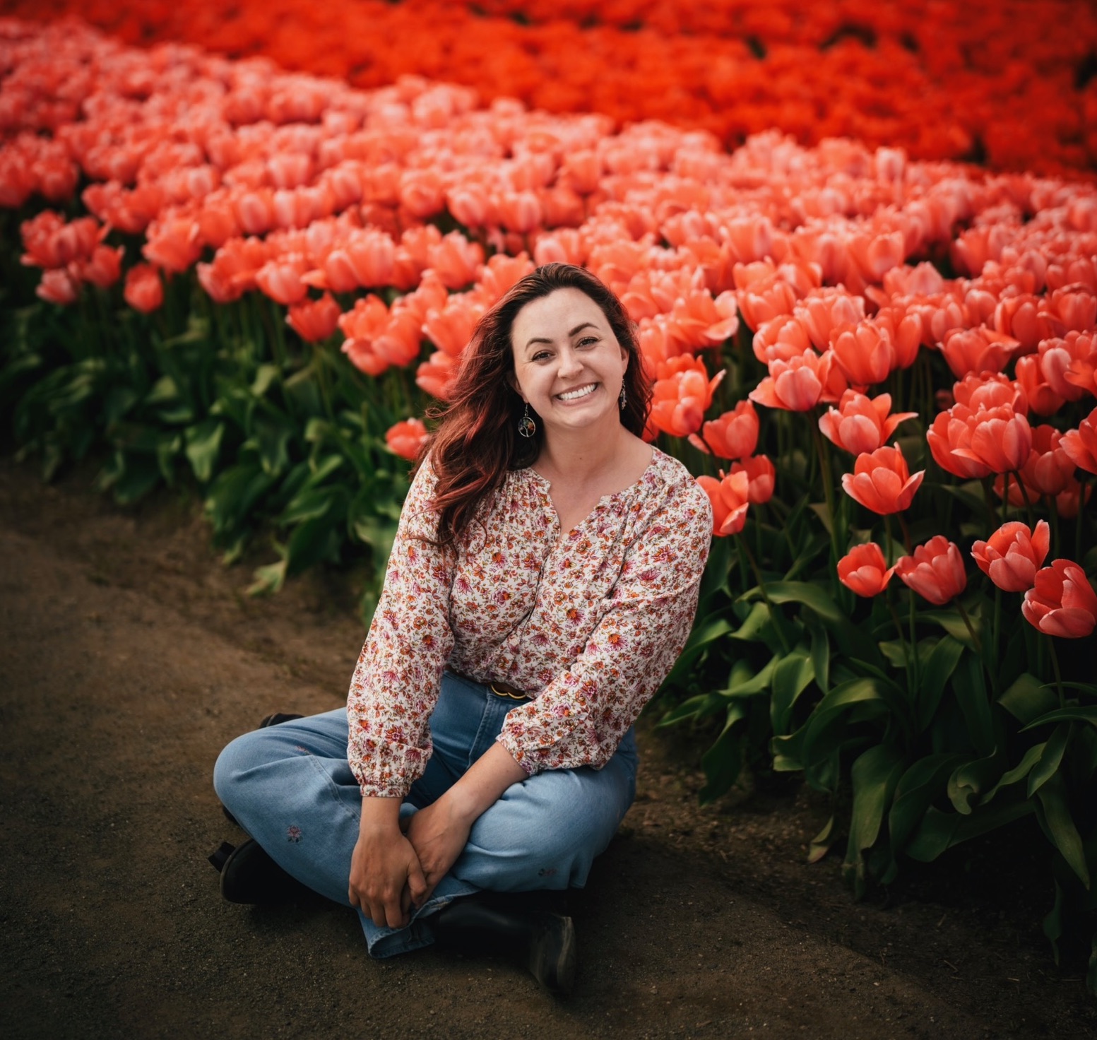 landscape designer posing in front of tulip field